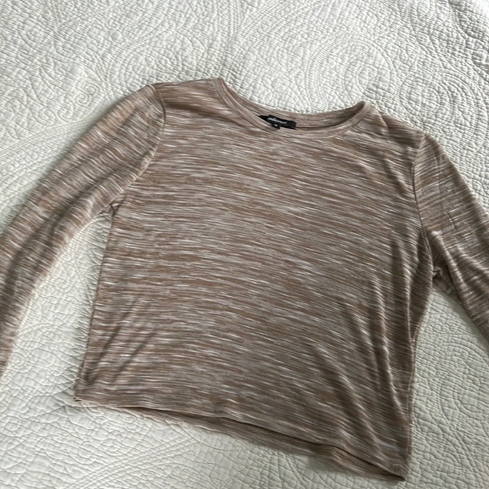 This is a thin material long sleeve t-shirt.